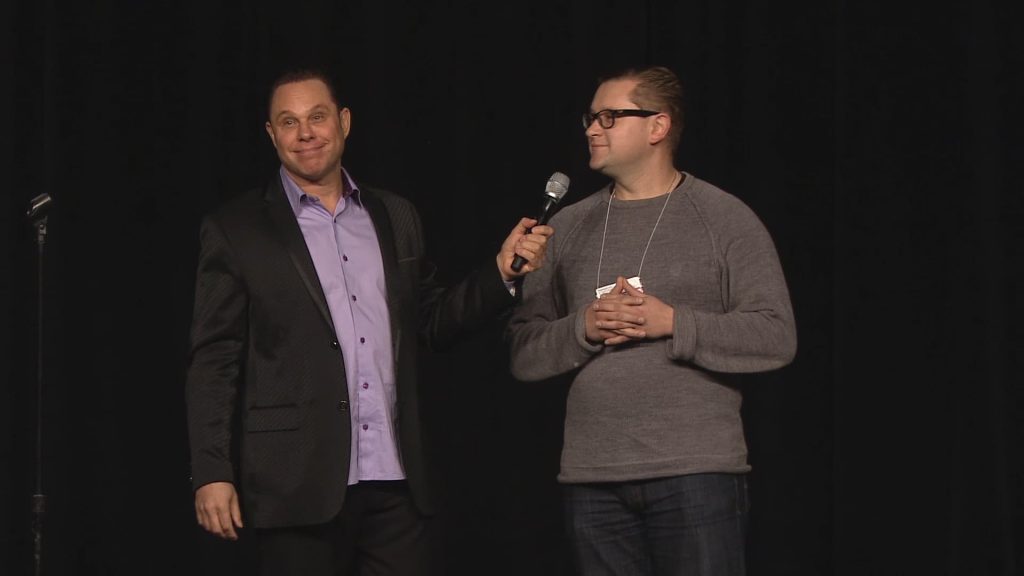Randy speaking to an audience member on one his show.