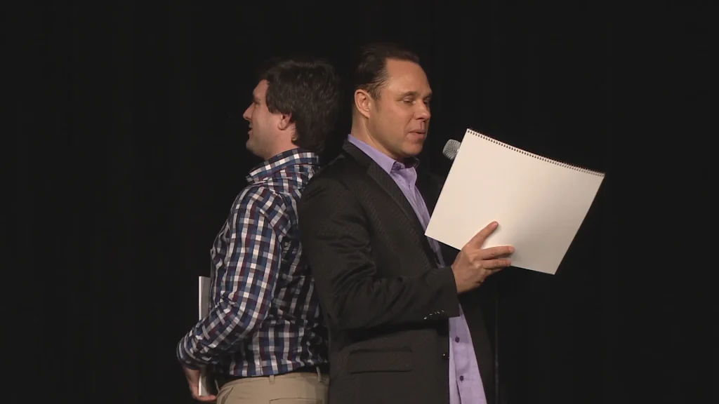 Randy Charach performing mentalism and magic with an audience member.