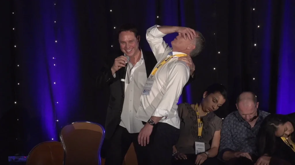 Audience participant showing surprise reaction due to magic and mentalism act by Randy Charach.