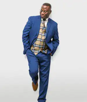 Craig Martin, a Seattle-based professional corporate specialist, wearing blue pants and a coat.