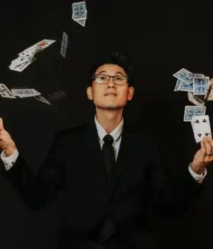 David Kuraya, throwing cards in the air. during one his magic act.