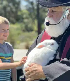 Joe Mystic with a kid during his magic performance.