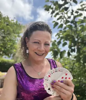Ms Charley, the magician, wearing purple velvet dress.