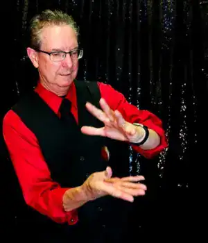 Magician Greg - Greg Wauson, performing an act during one of his shows.