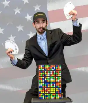 Taylor Kyle, holding cards with colorful blocks in front of him.